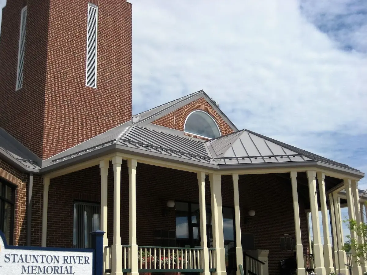 Skilled roofing craftsmen working on a residential roof in Longswamp